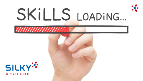 Ladebalken, halb gefüllt. Darüber steht Skills loading. Eine Hand zeichnet den roten Balken. 